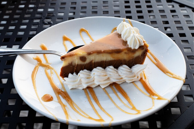 Salted caramel cheesecake on white plate