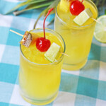 Pineapple mai tai cocktails on checkered tablecloth