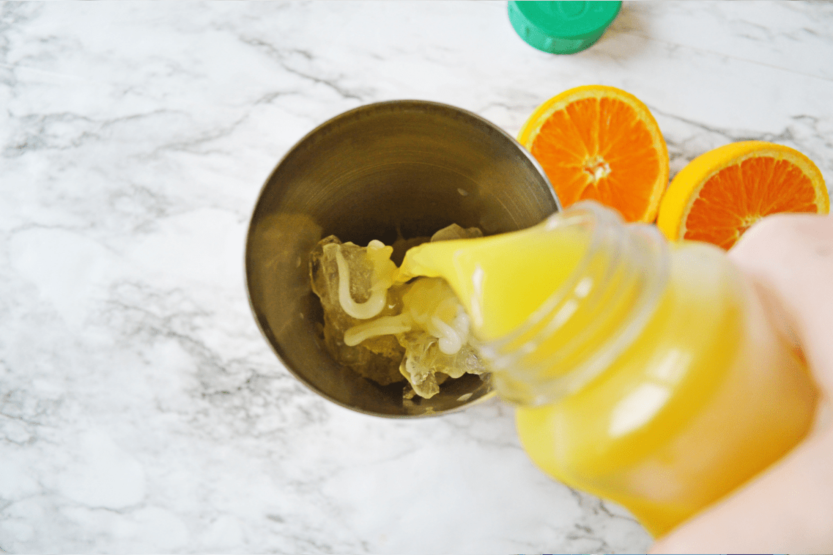Combining orange juice with vodka and cream of coconut