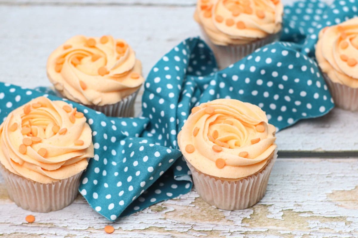 Peach cupcakes with blue polka dot napkin