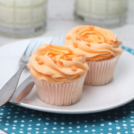 Peach cupcakes on white plate