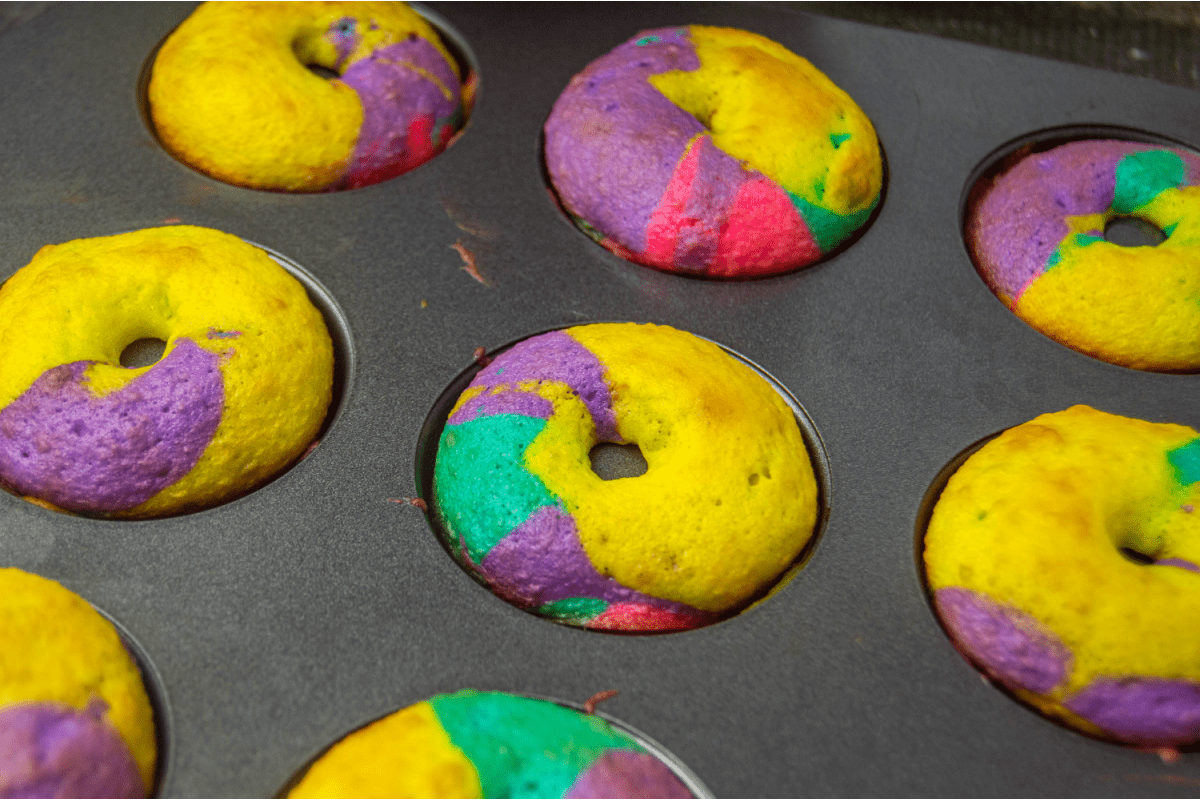 Cooked rainbow donuts in donut pan