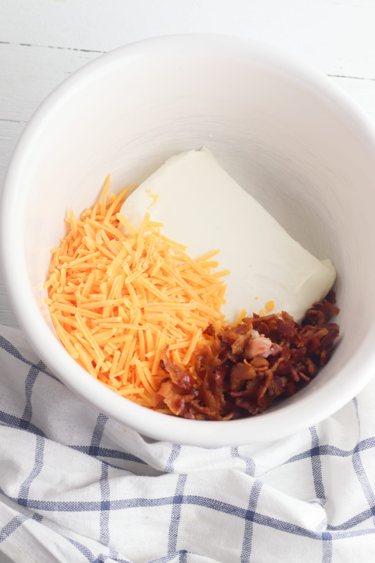 Cream cheese, cheddar and bacon in bowl