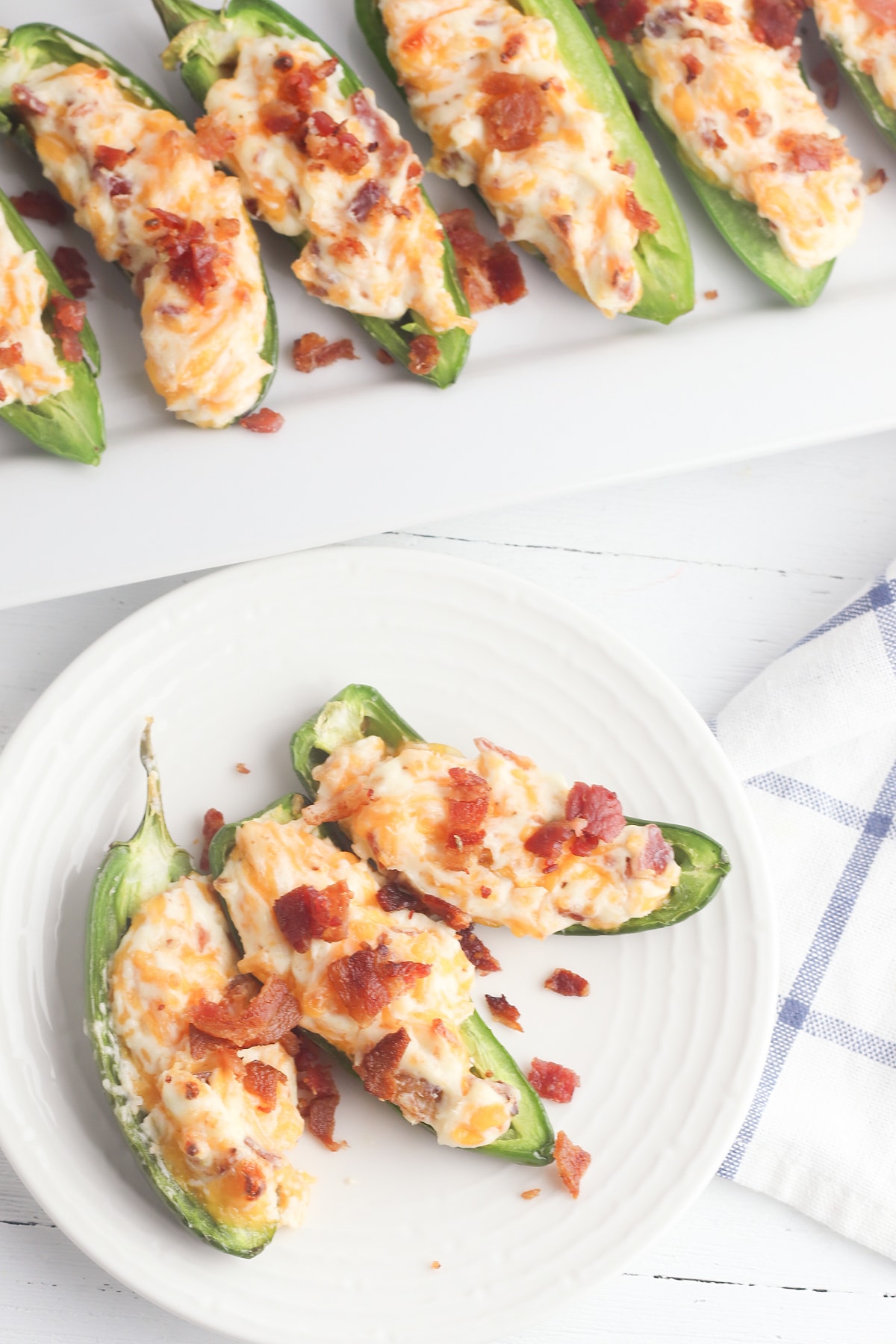 Jalapeno poppers on round white plate