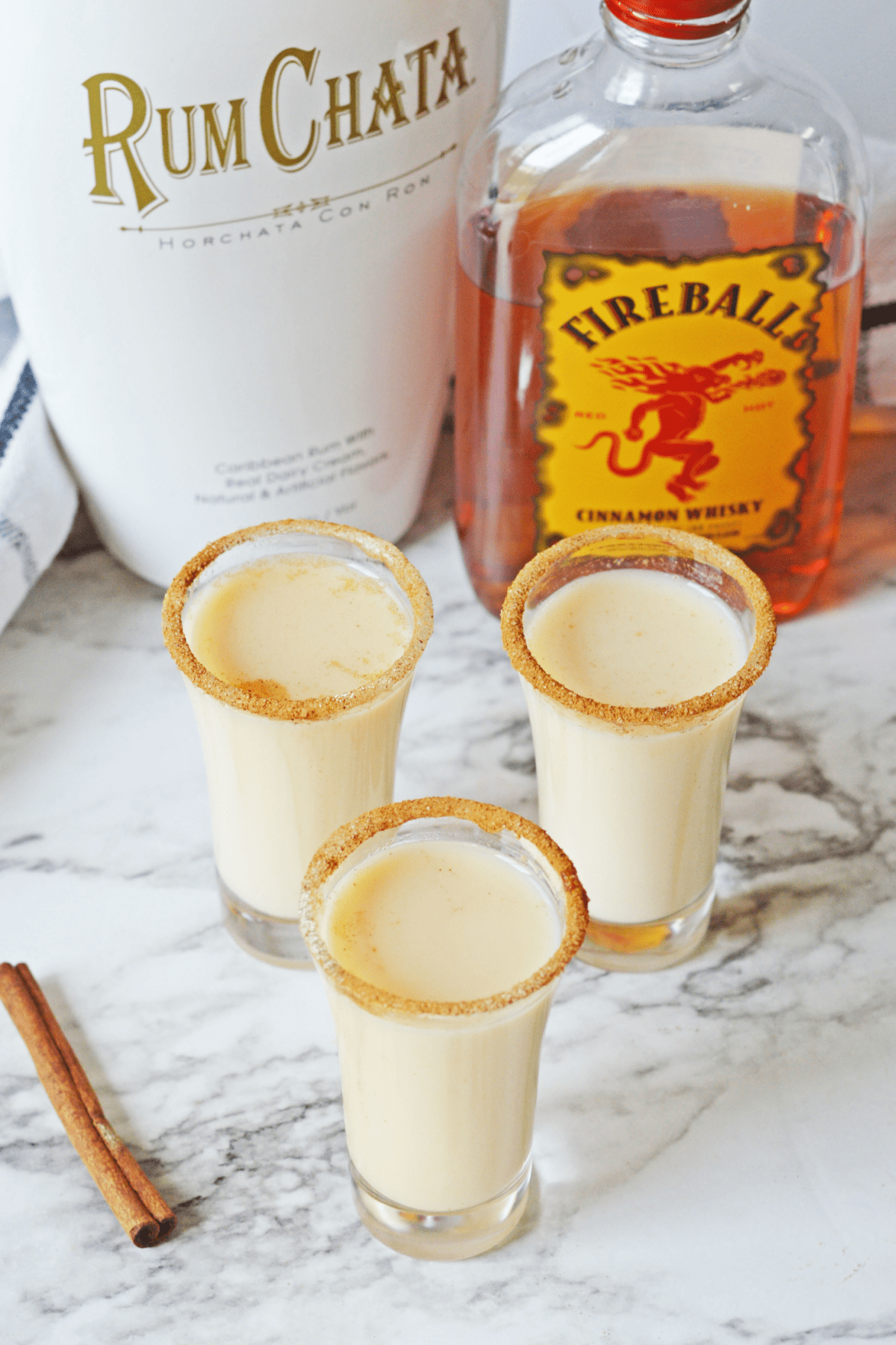Cinnamon Toast Crunch shots with alcohol bottles