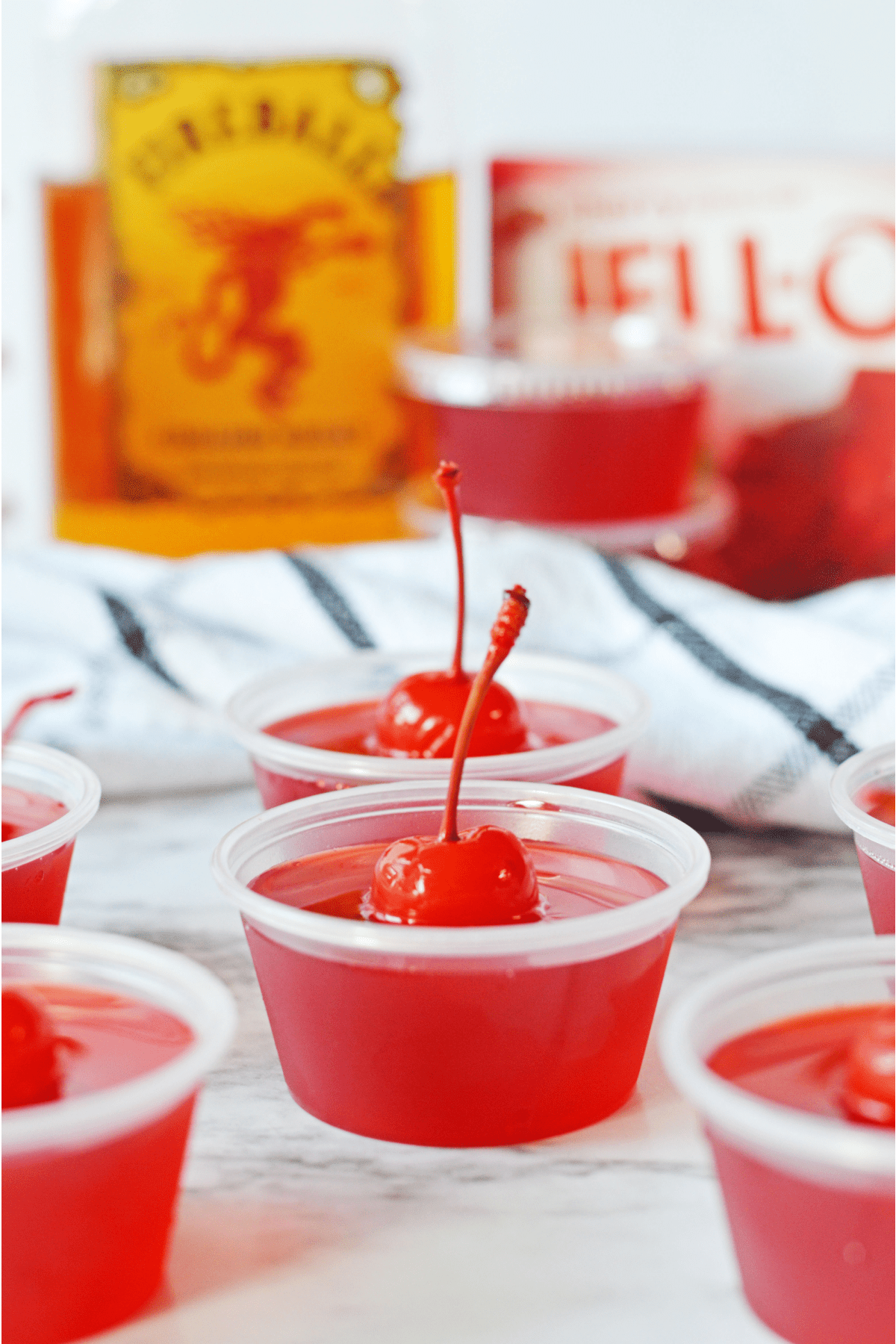 Jello shots with bottle of fireball in background