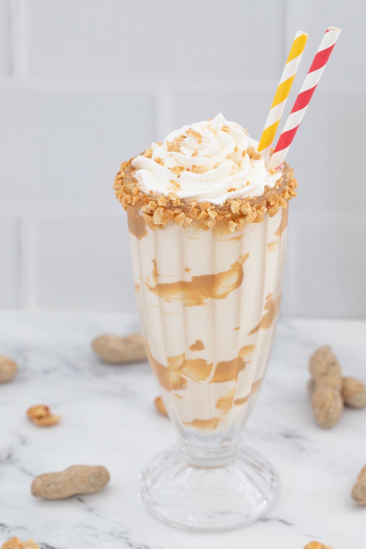 Peanut Butter Milkshake with red and yellow straws