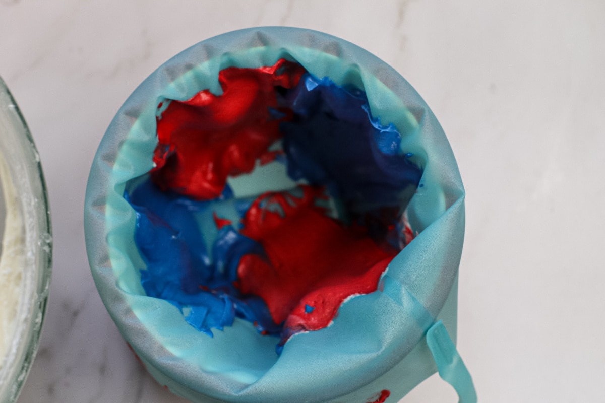 Red and blue frosting added to pastry bag