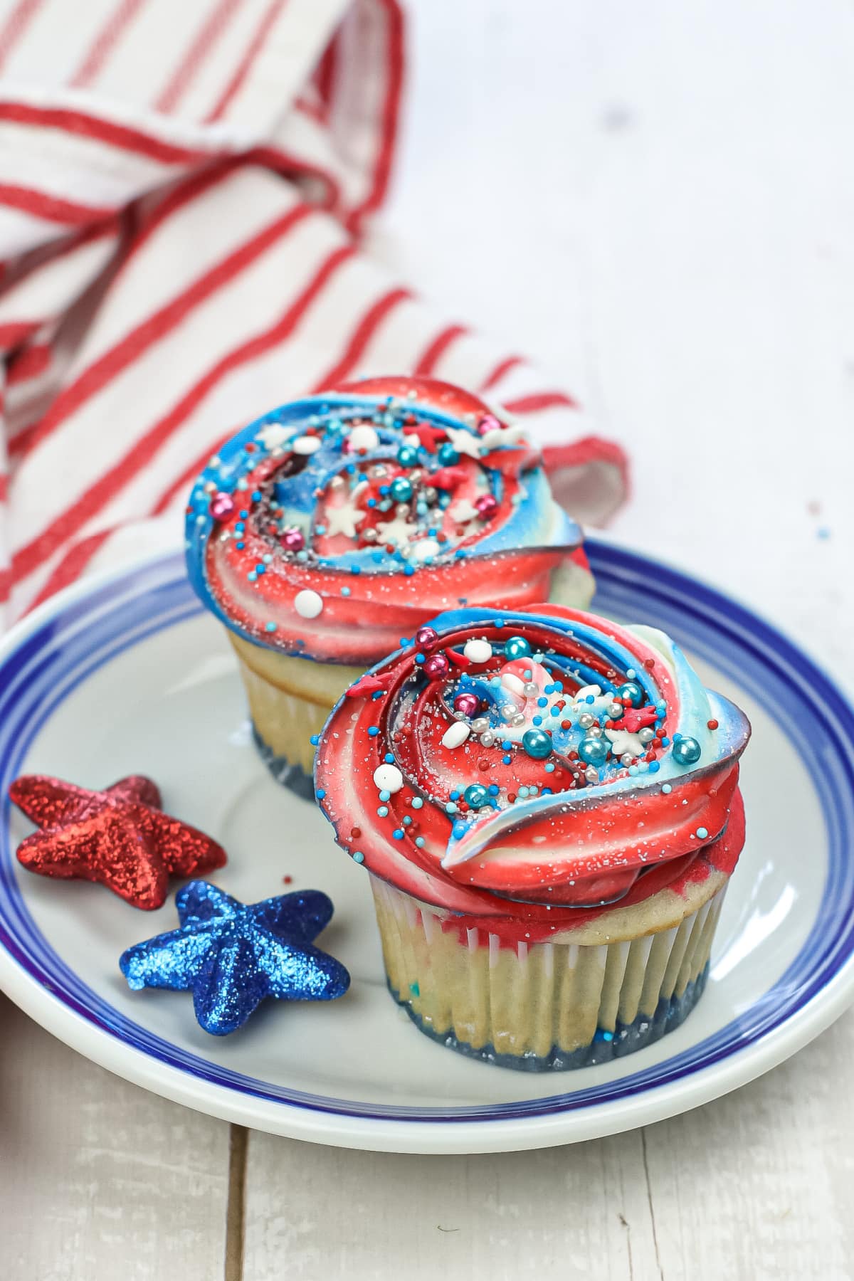 Red White and Blue cupcakes on blue and white plate