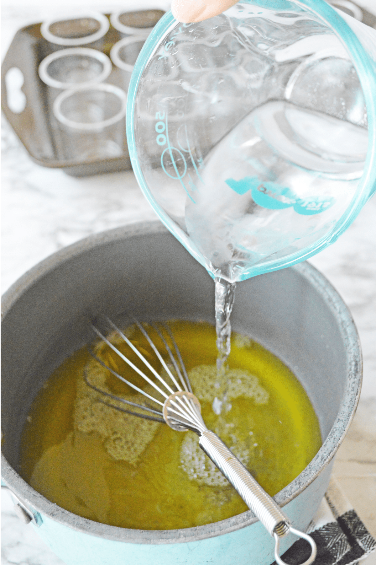 Pouring cold water into jello mixture