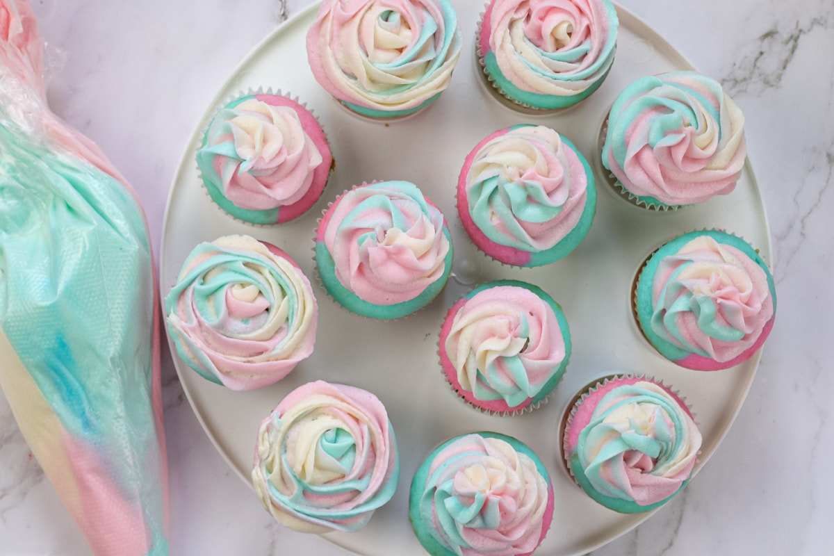 Pink and blue cupcakes with icing