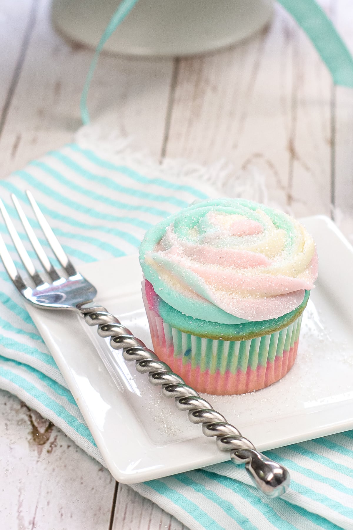 Cotton candy cupcake on plate