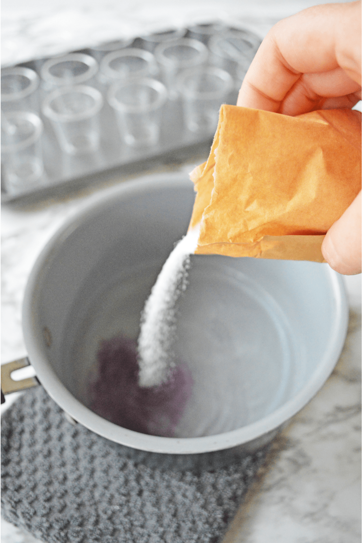Pouring jello mix into a bowl
