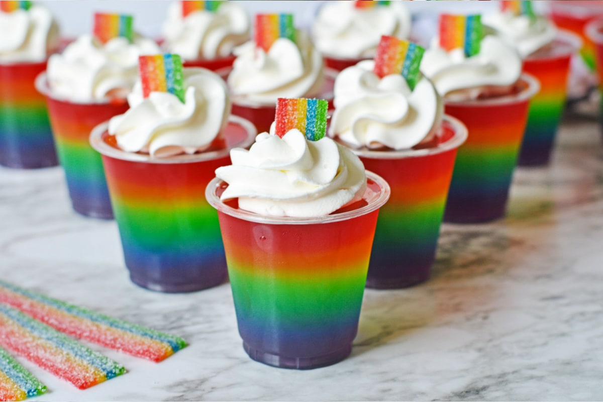 Rainbow jello shots in plastic cups