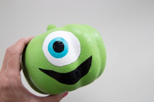 Pupil and mouth painted on Mike Wazowski pumpkin