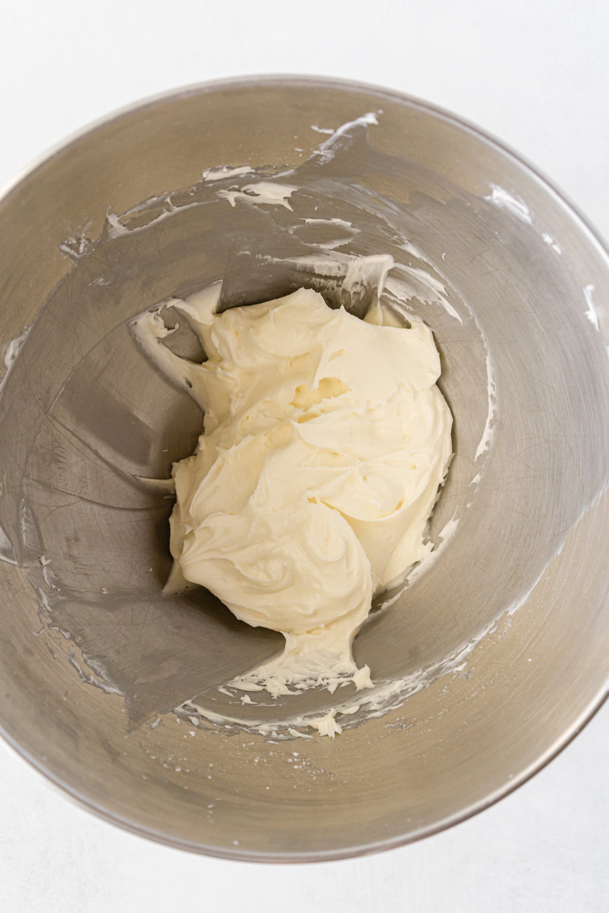 Cream cheese and sugar combined in bowl