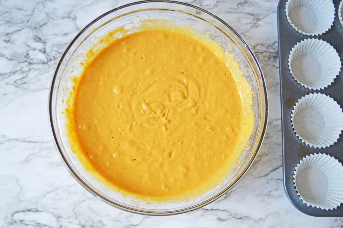 Batter for pumpkin cake mix in glass bowl