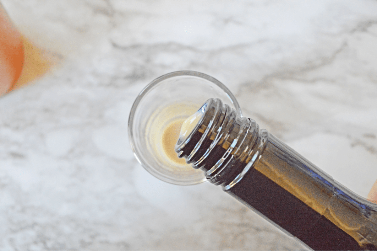 Pouring Baileys into shot glass