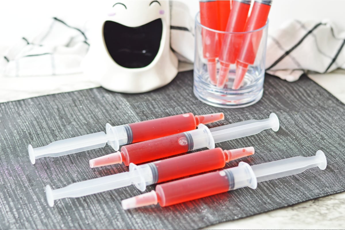 Syringe jello shots laying on side
