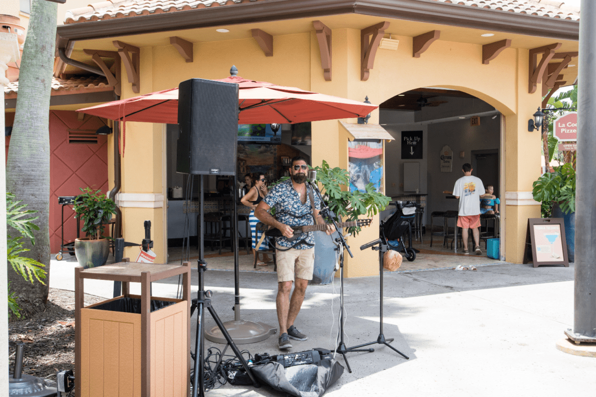 Singer performing in front of bar at pool