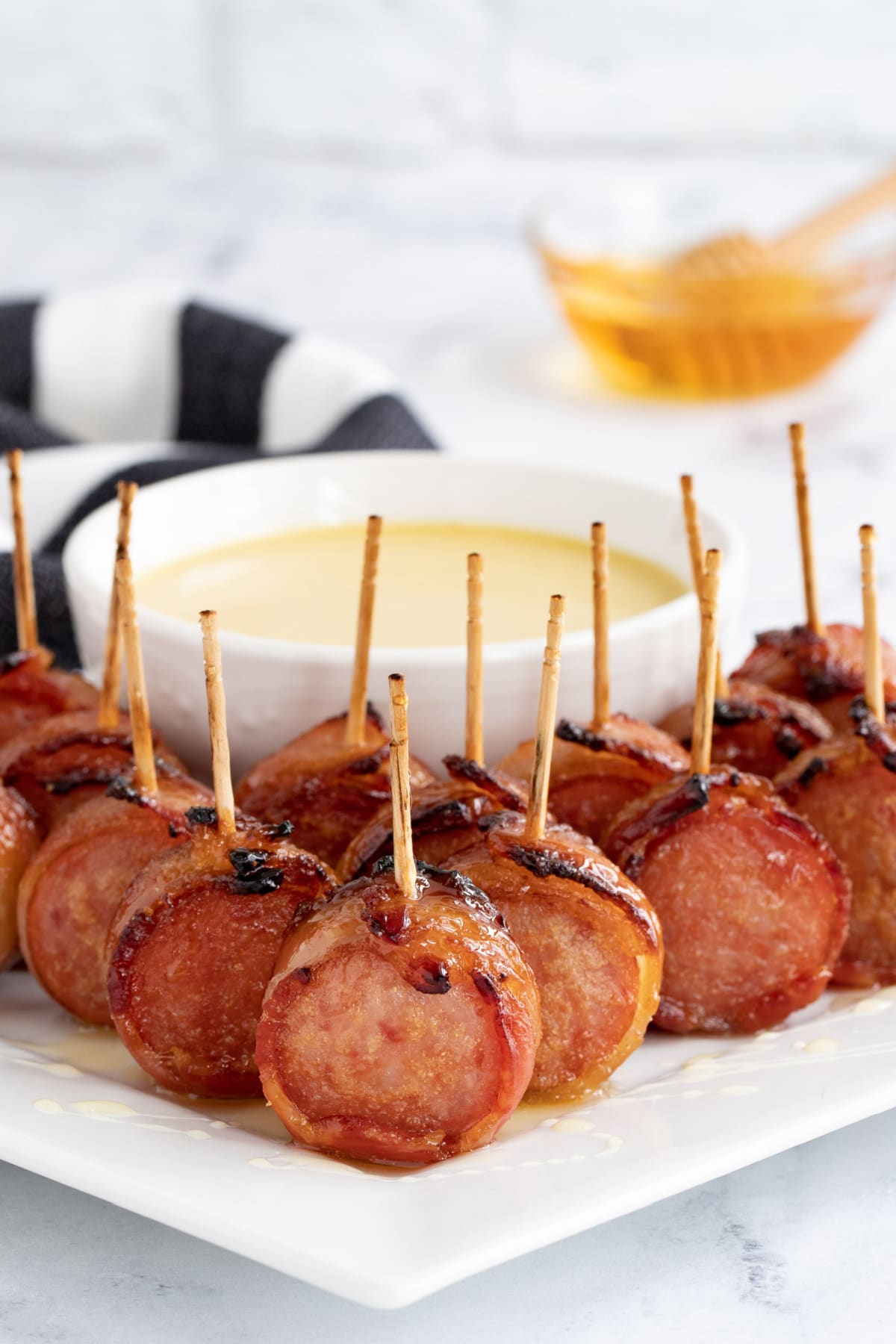 Bacon wrapped sausage with honey mustard sauce