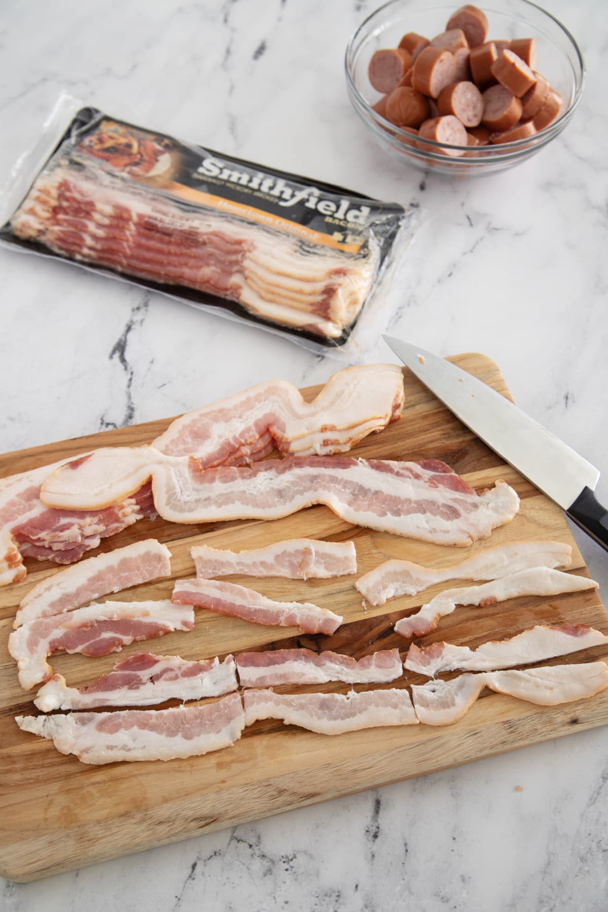 Slicing bacon for bacon wrapped sausage