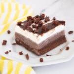 Piece of brownie ice cream cake on plate for recipe card