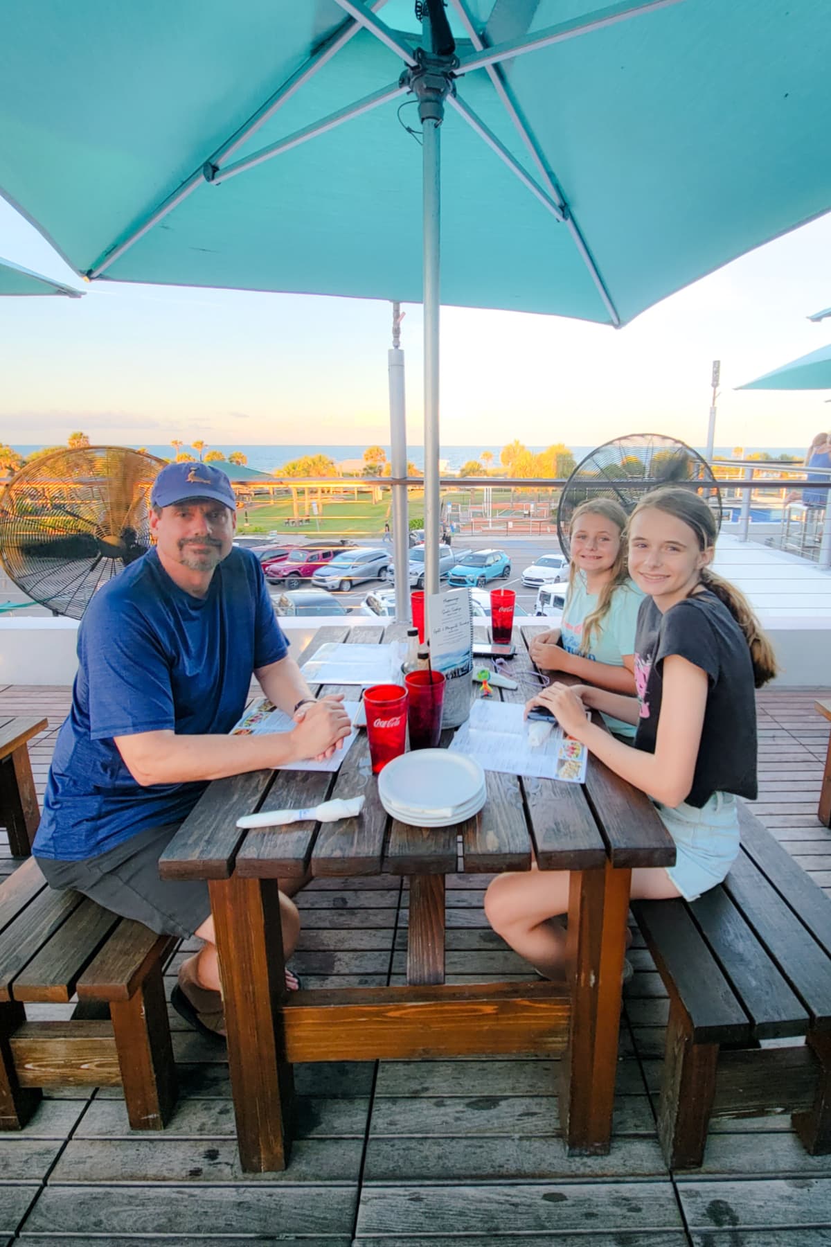 Family dining by the ocean
