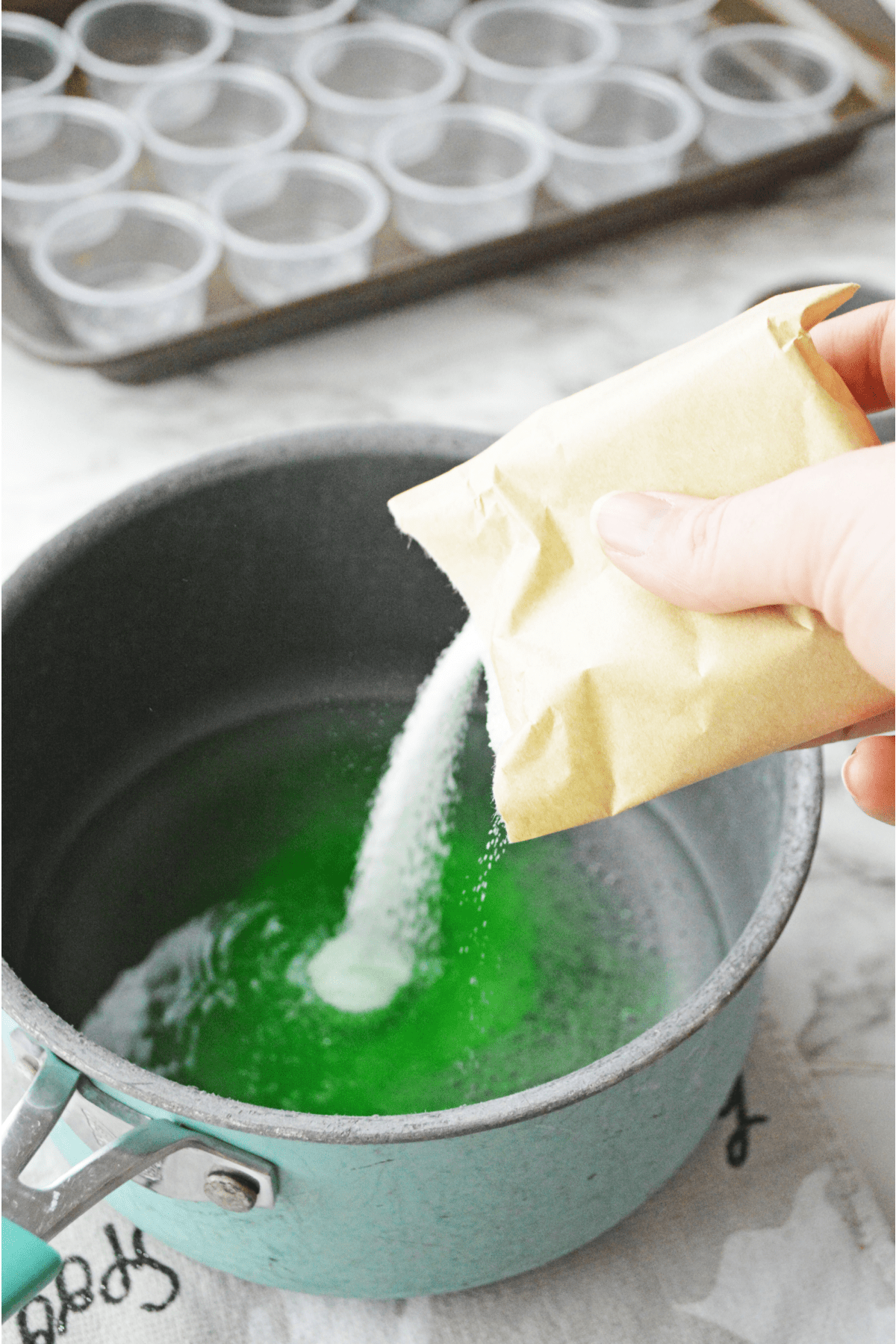 Adding lime jello to boiling water