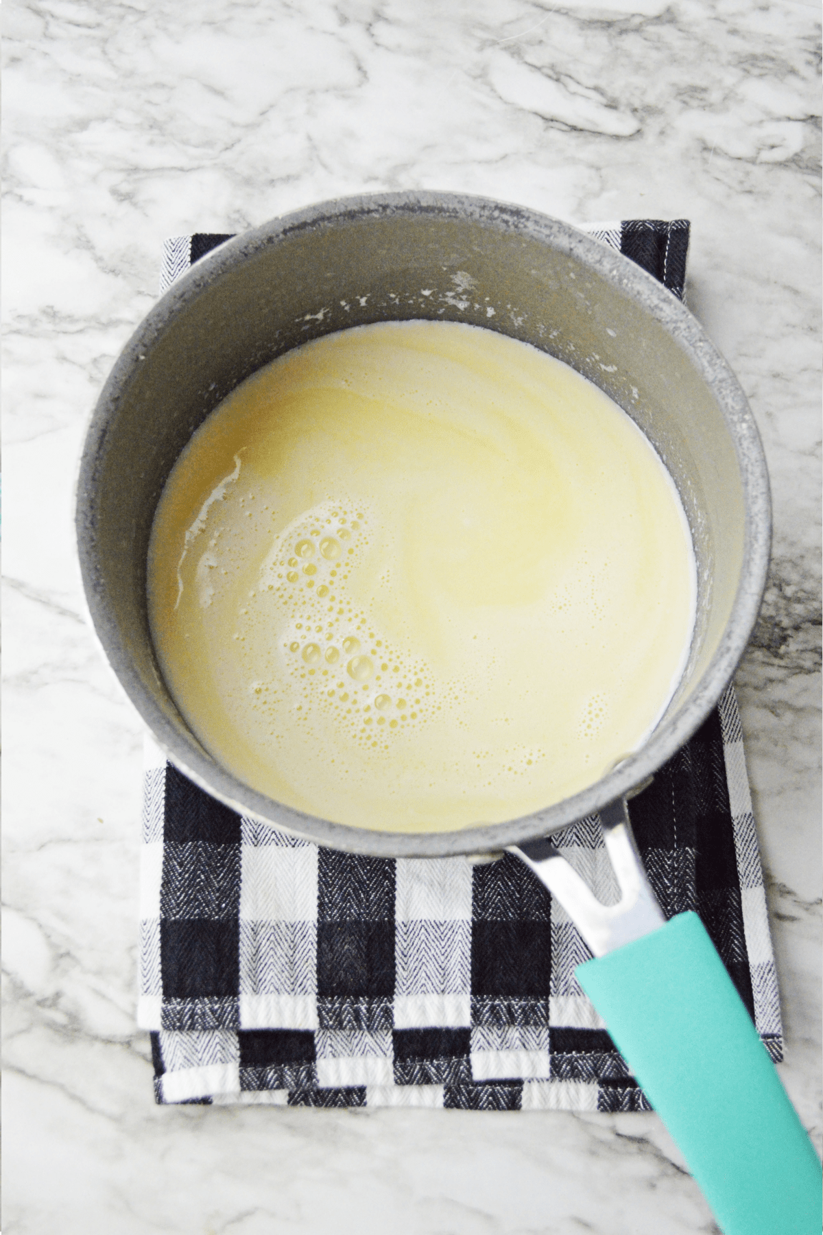 Butter and milk mixture in saucepan