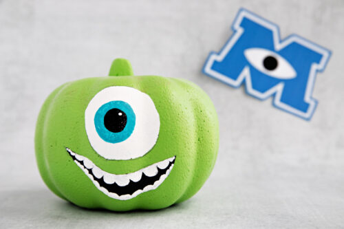 Mike Wazowski pumpkin with Monsters Inc. logo