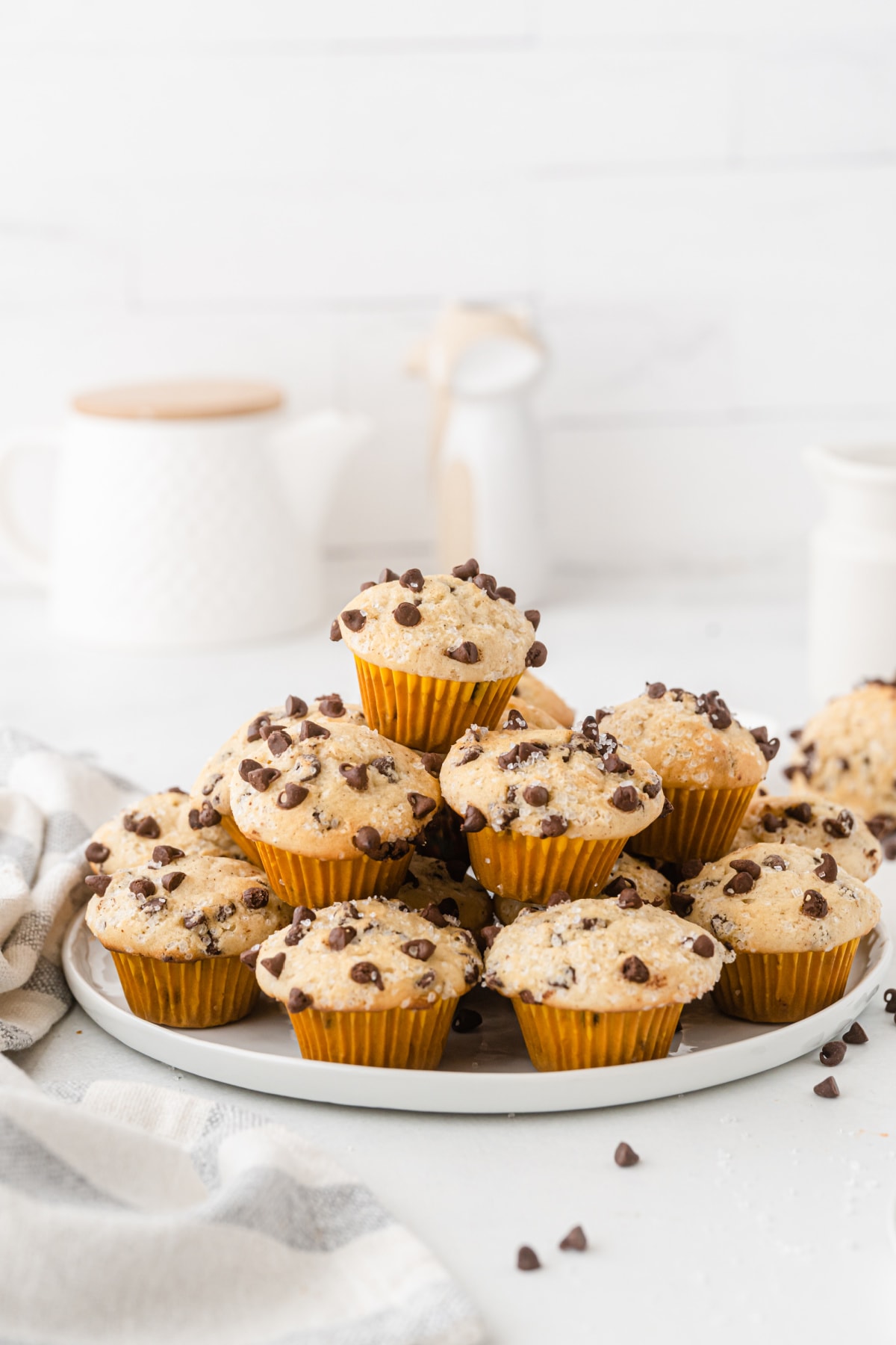 Mini Chocolate Chip Muffins stacked on plate