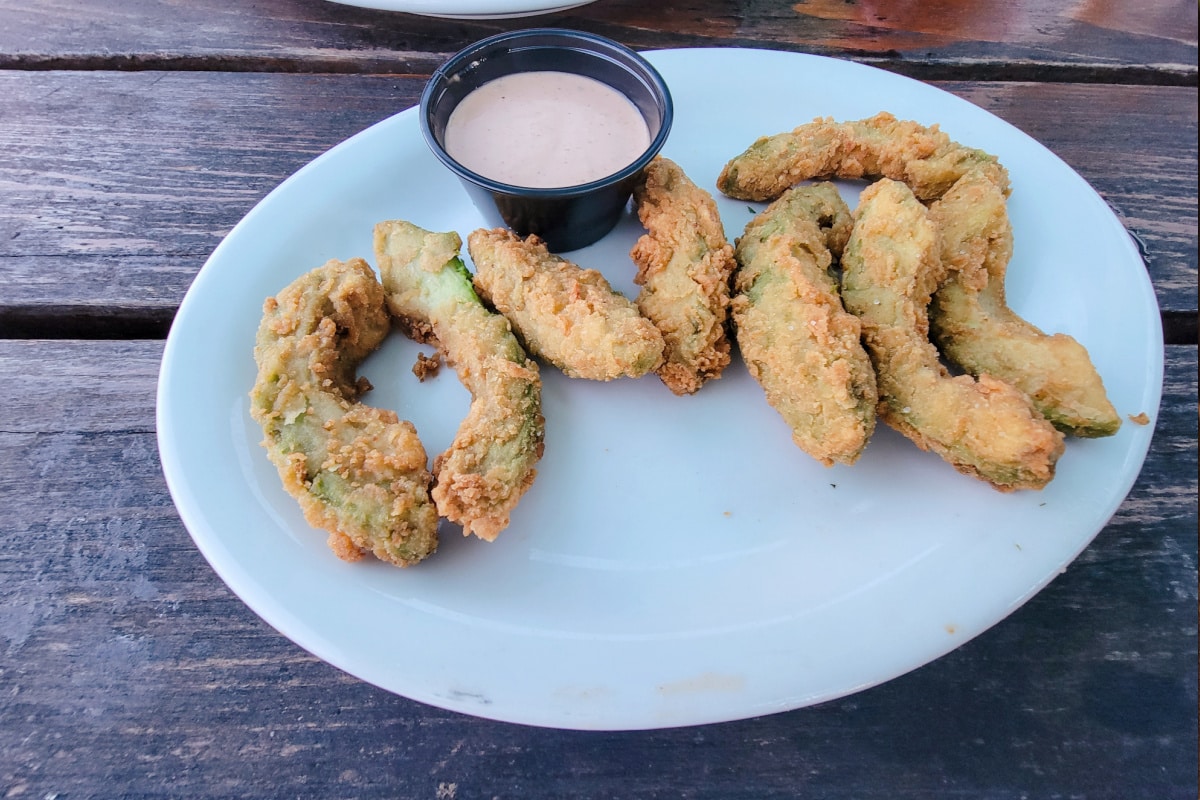 Fried avocados on white plate
