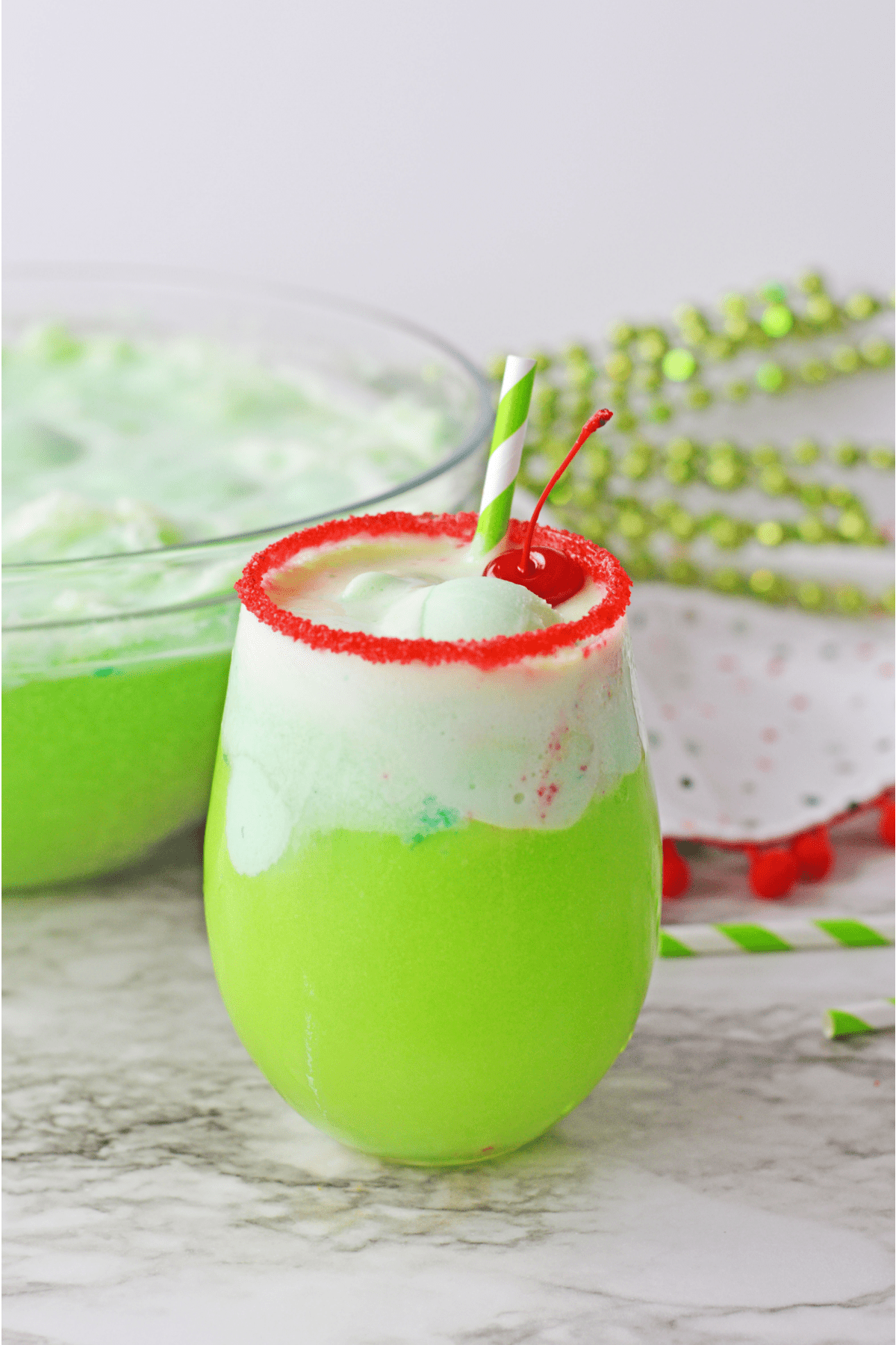 Grinch punch with striped straw