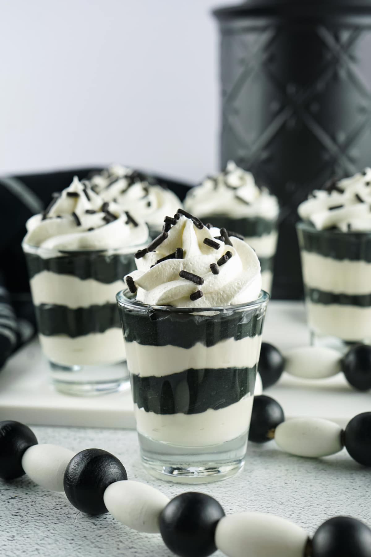 Halloween pudding shots with whipped cream