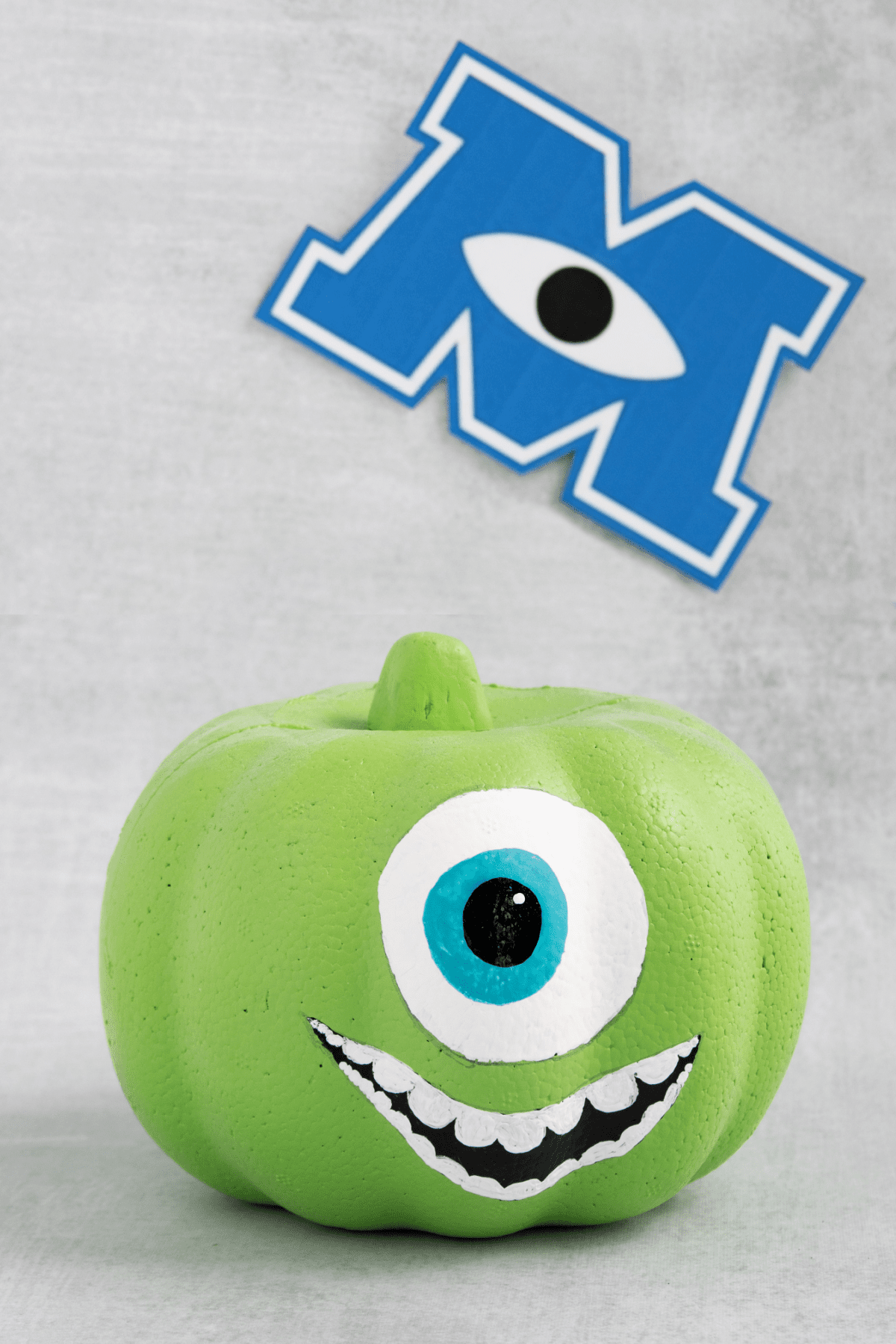 Mike Wazowski pumpkin with Monsters Inc logo