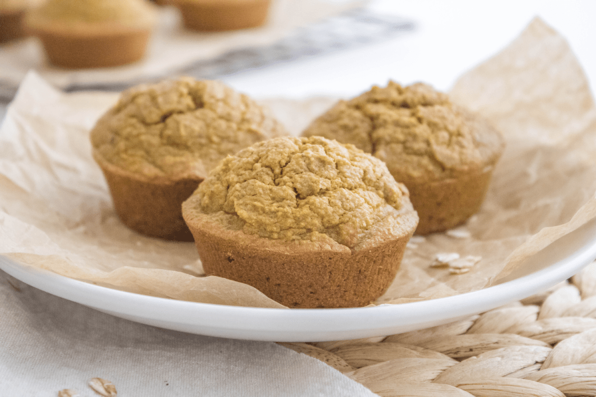 Pumpkin oatmeal muffins on plate with brown paper
