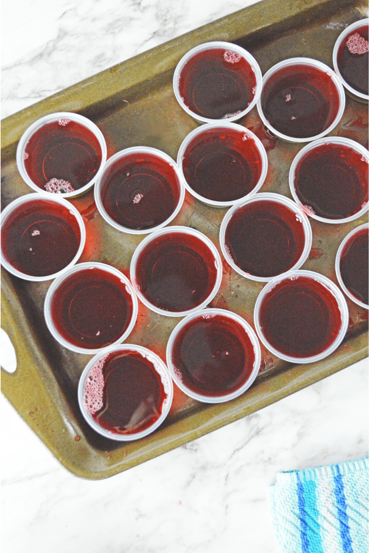 Red jello in plastic cups
