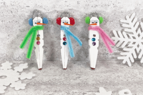 Clothespin Snowman Craft with snowflake decor