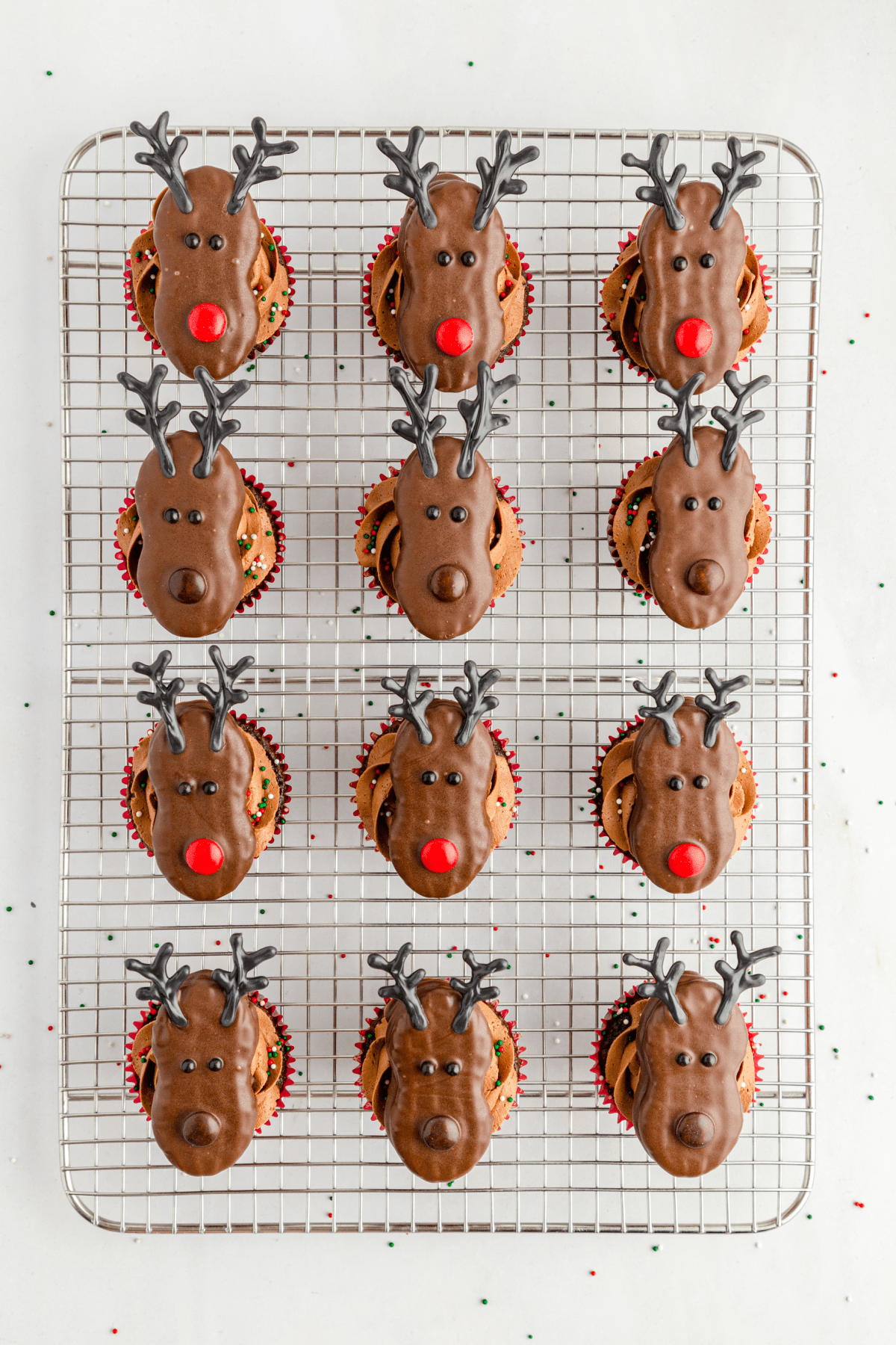 Chocolate cupcakes topped with reindeer