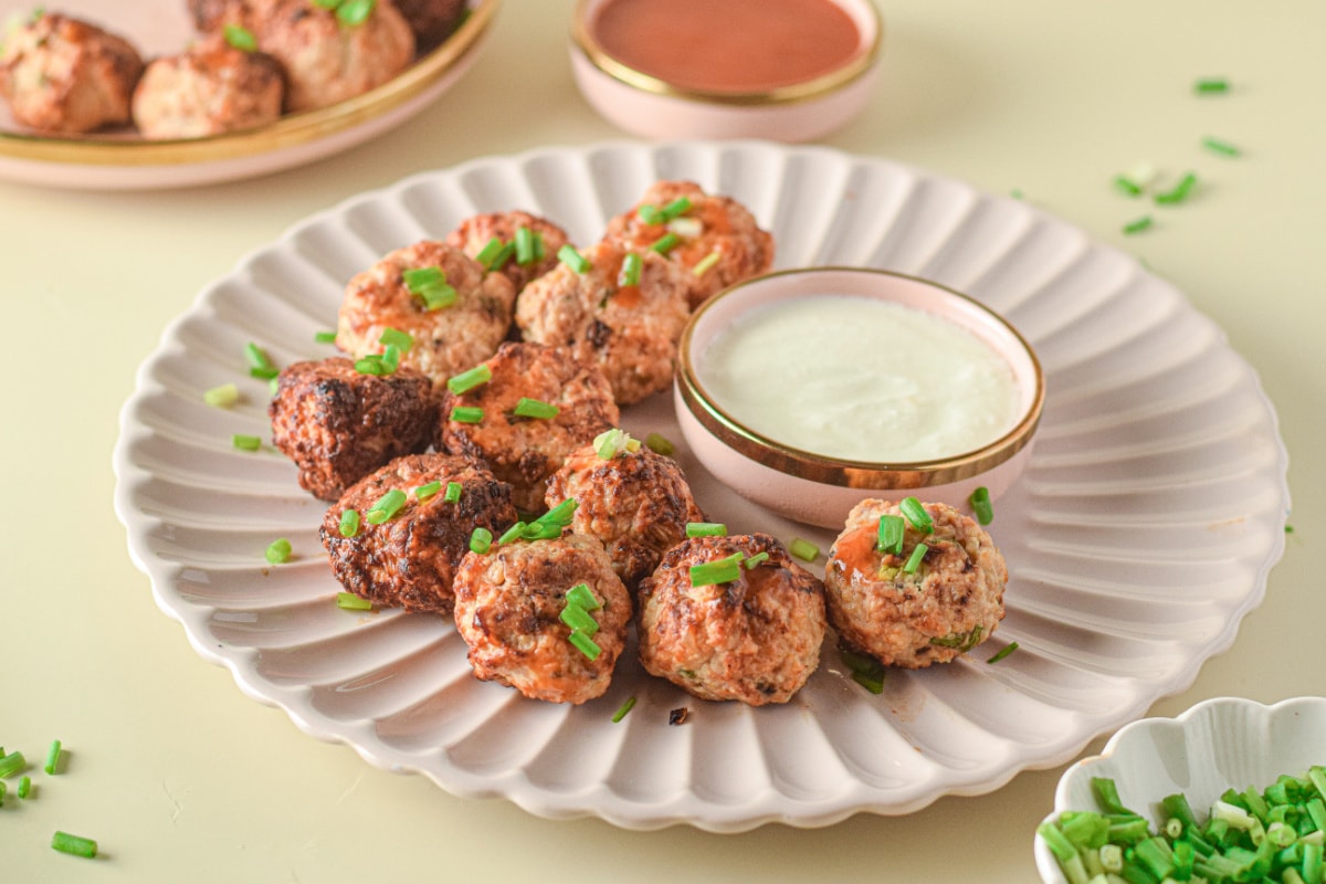 Meatballs on plate with white dipping sauce