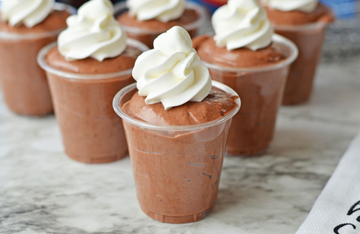Bailey's Chocolate Pudding shots topped with whipped cream