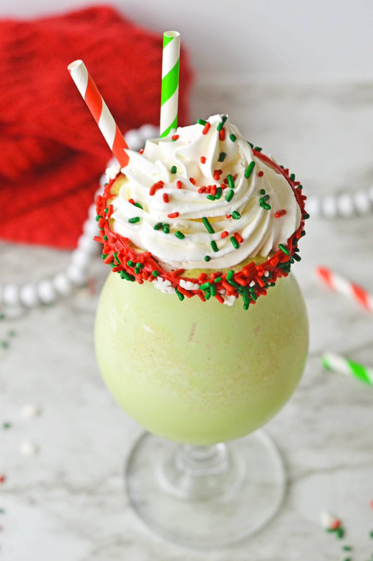 Christmas milkshake with whipped cream and sprinkles