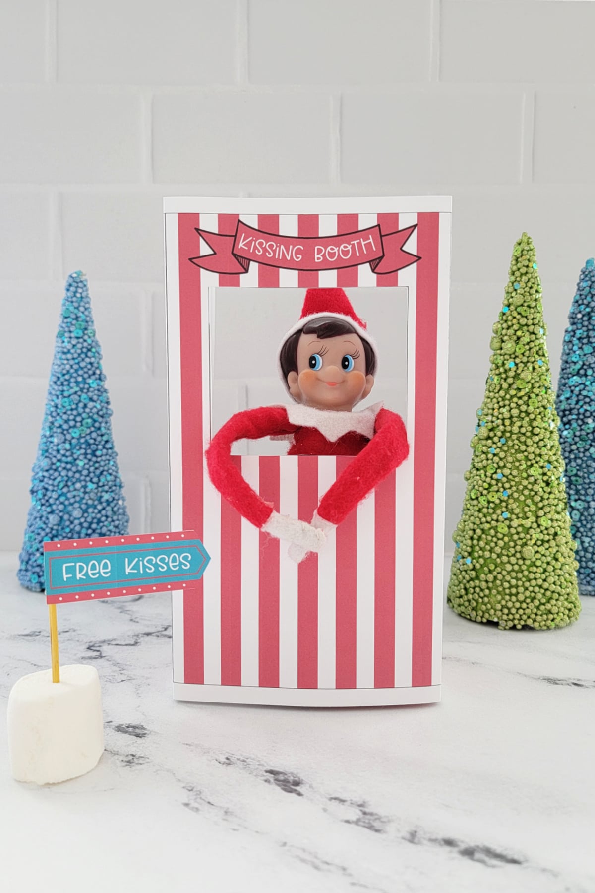 Elf On The Shelf in kissing booth