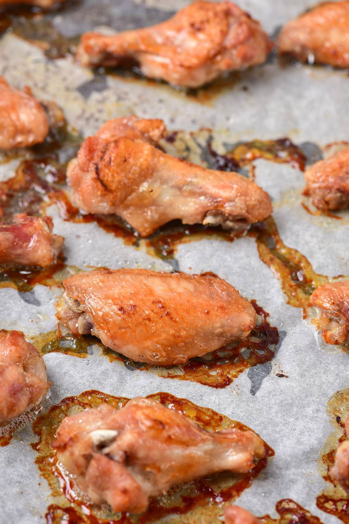 Baked wings on parchment paper