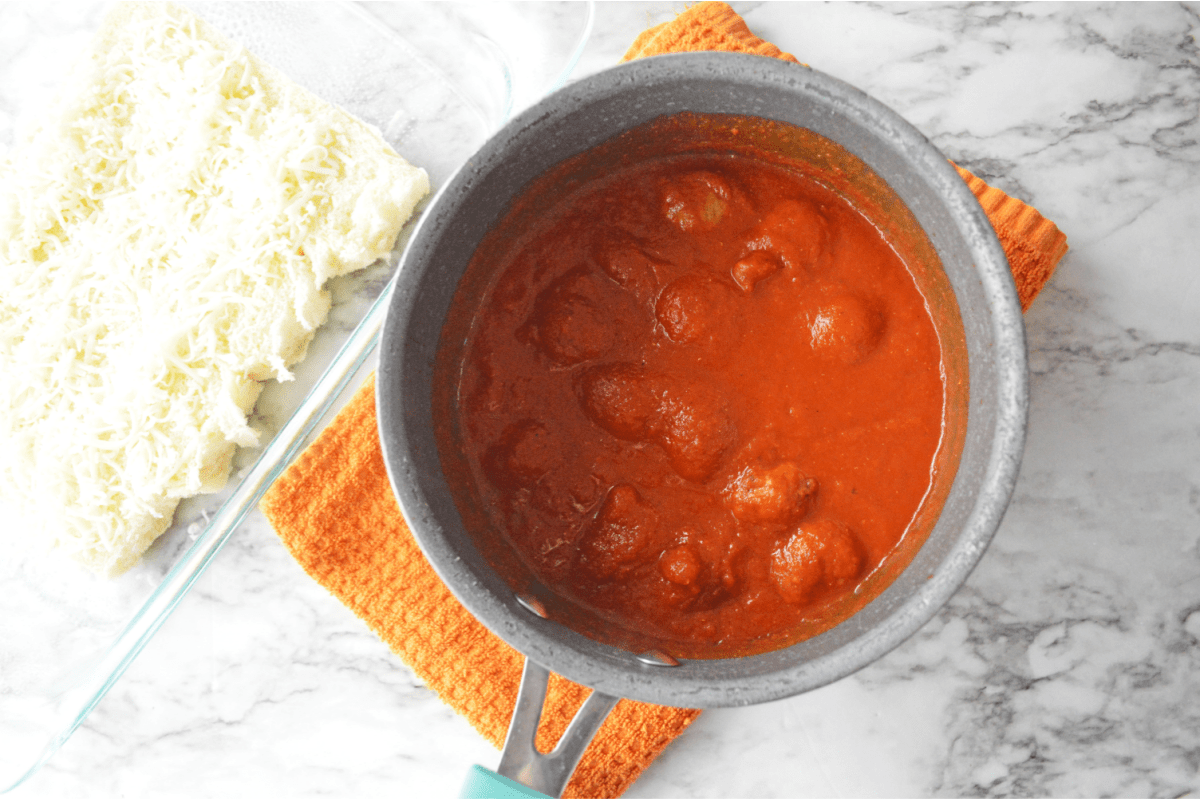 Meatballs with pasta sauce in saucepan