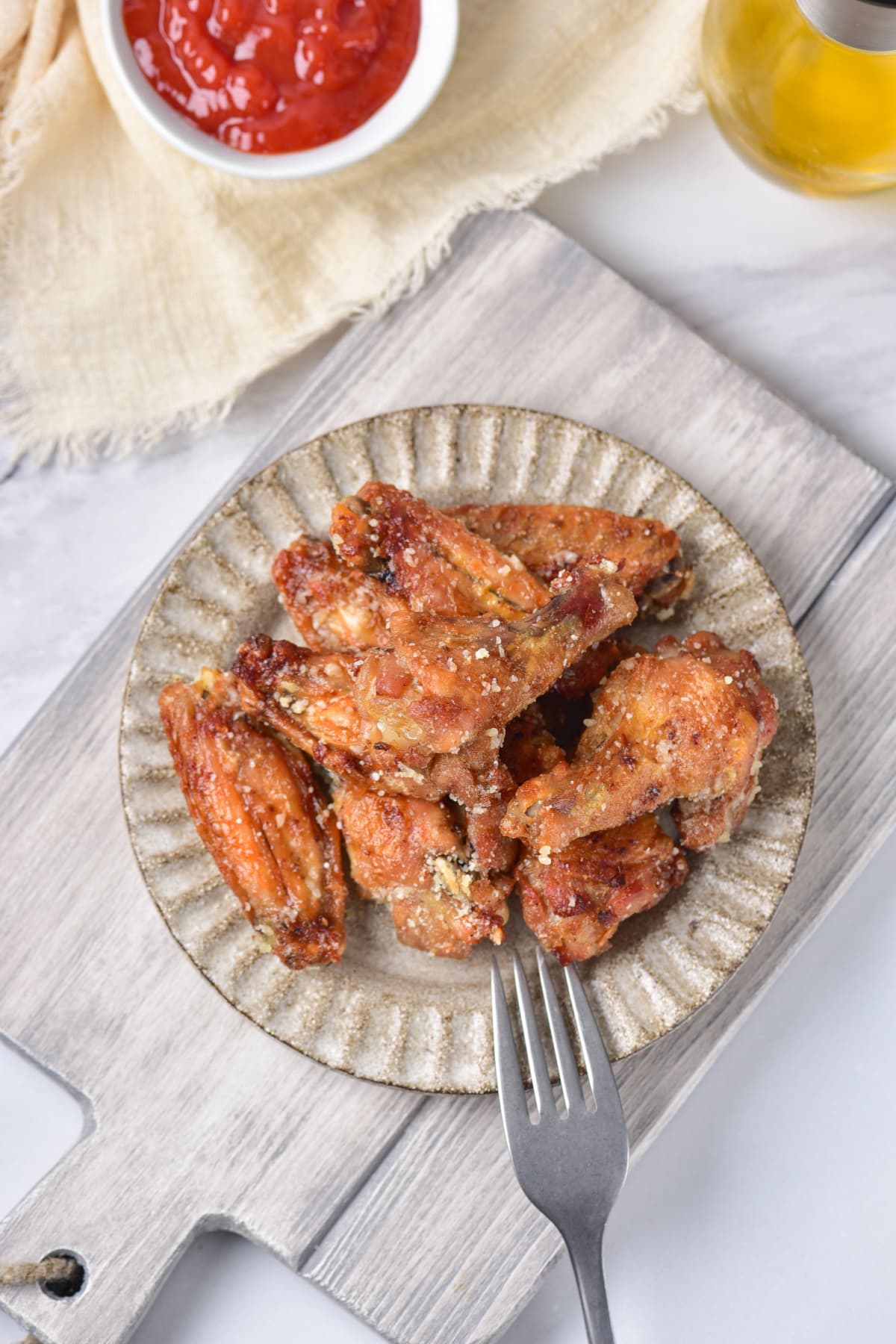 Garlic Parmesan Wings on plate with fork