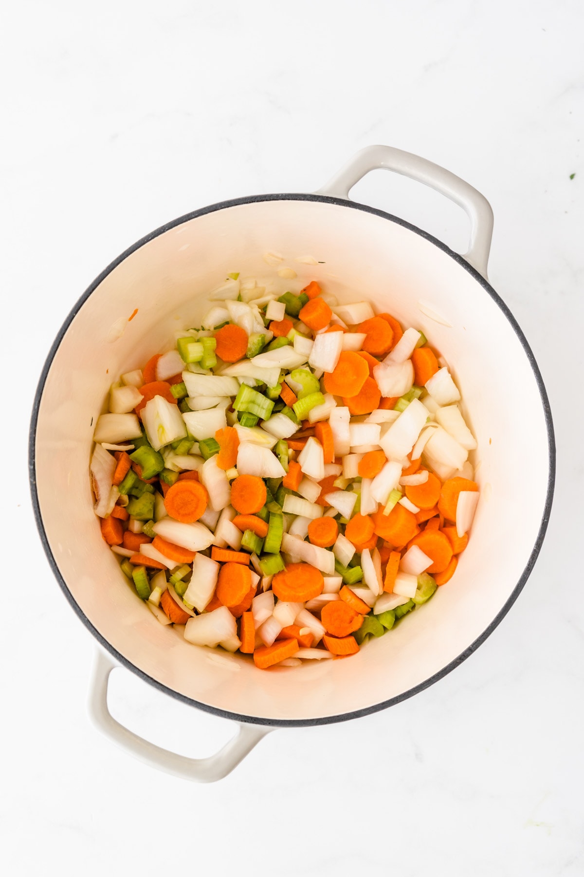 Carrots, onions and celery in pot