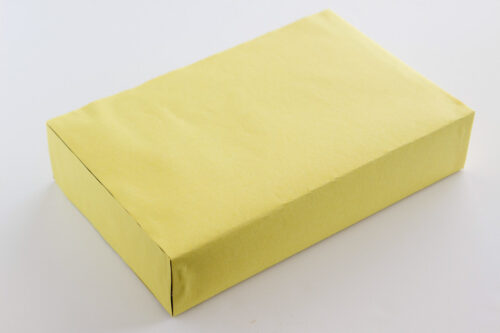 Cereal box wrapped in yellow construction paper