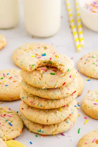 Funfetti cookies stacked on plate